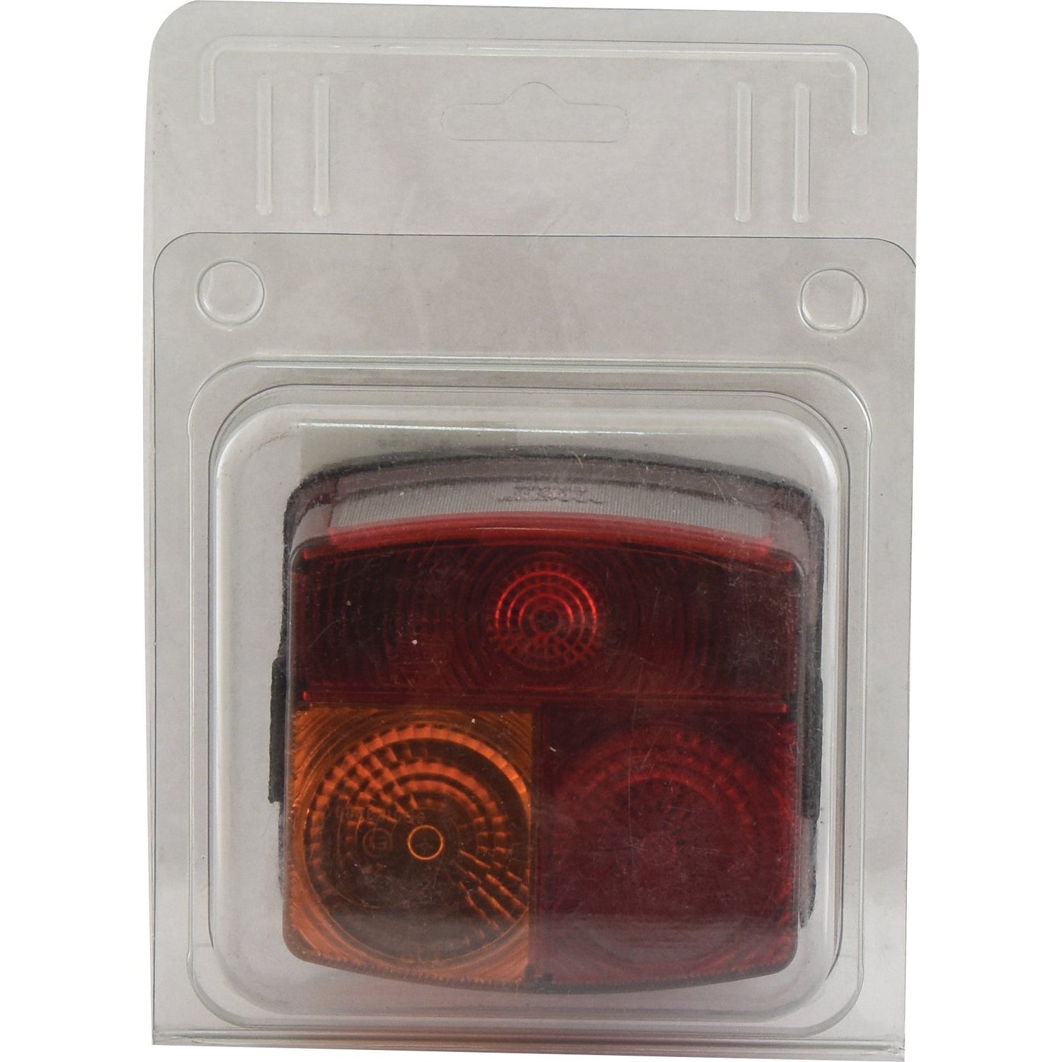 A packaged rectangular Sparex Rear Combination Light, featuring a halogen brake/tail/indicator/number plate light for the right-hand side, compatible with 12/24V systems (S.27499), includes one red lens and one amber lens. The item is sealed in clear plastic and set against a white cardboard backing.