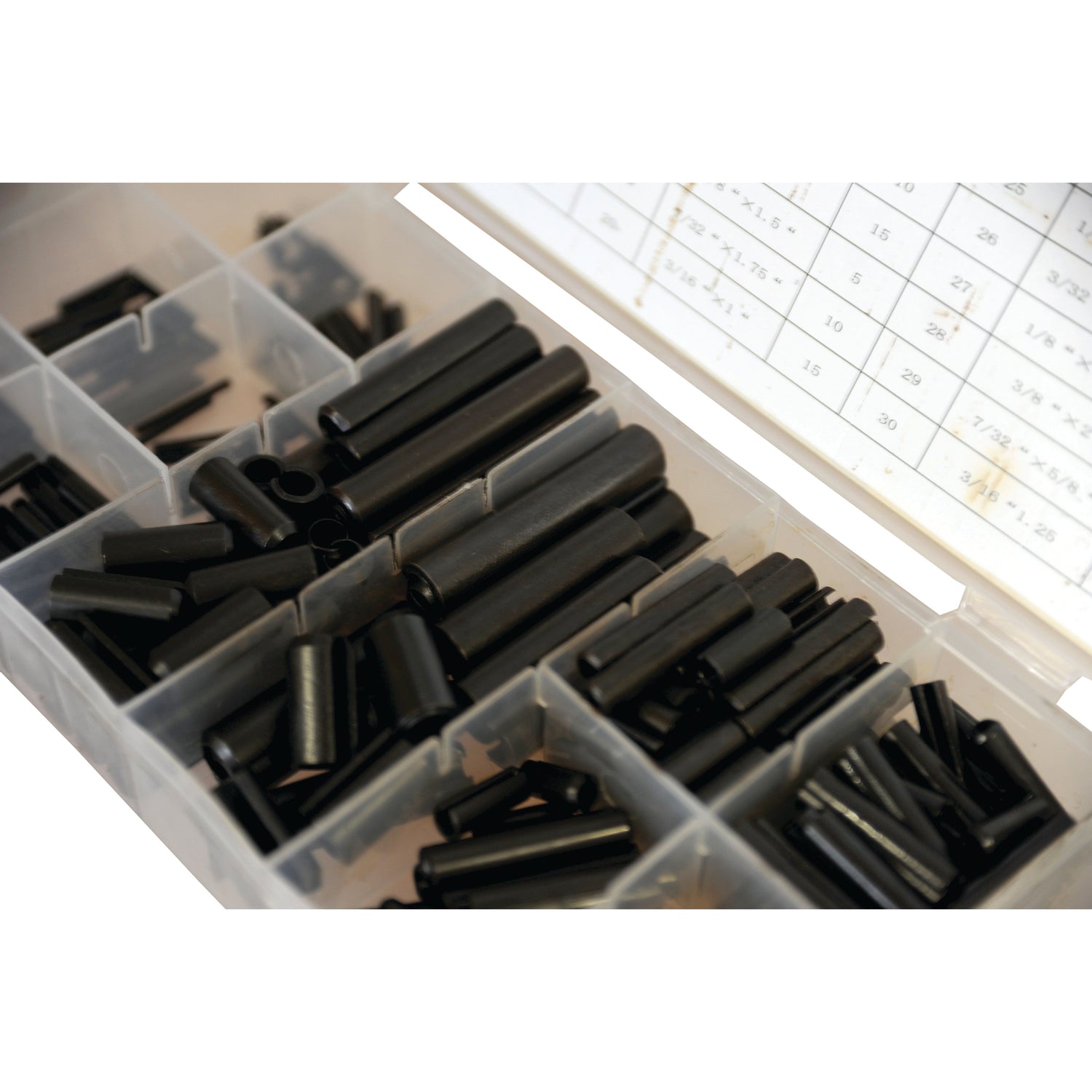 A plastic compartment box containing 315 Sparex black metal Imperial Roll Pins (5/16'' - 1/4'') with a measurement chart inside the lid, according to DIN 1481 standards.

