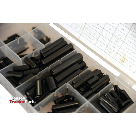 A plastic organizer labeled "Sparex" contains various sizes of dark cylindrical parts specified as Imperial Roll Pins (5/16'' - 1/4'', 315 pieces, DIN 1481 standards) with the product number S.29888. The bottom left corner displays "Massey Tractor Parts," and a chart of measurements is partially visible nearby.