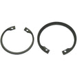 Two black snap rings, one smaller and the other larger, each with notches at their openings, are used for securing components on a shaft or in a bore. The Internal Circlip 33mm (Sparex Part No.S.2827) from Sparex conforms to DIN 472 standards for reliable performance.