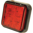 Close-up of the Sparex LED Fog Light, 10-30V (RH & LH), part no. S.113396, showcasing its red, square-shaped design with a black casing and multiple small LEDs visible under the red lens. This light also boasts an IP68 rating for optimal durability.