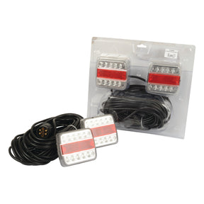 The Sparex LED Lighting Set S.25388 features red and white lenses for brake, tail, indicator, and number plate lights. It includes two 12-meter coiled black cables, a 7-way plug, and a magnetic connection for easy attachment.