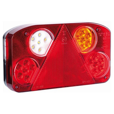 Close-up of the Sparex LED Rear Combination Light, featuring a central red triangle reflector, white and red LEDs on the left, and yellow and red LEDs on the right. This versatile light has functions for brake, tail, indicator, fog, reverse, and number plate illumination. It is suitable for a range of car models operating at 12-24V.