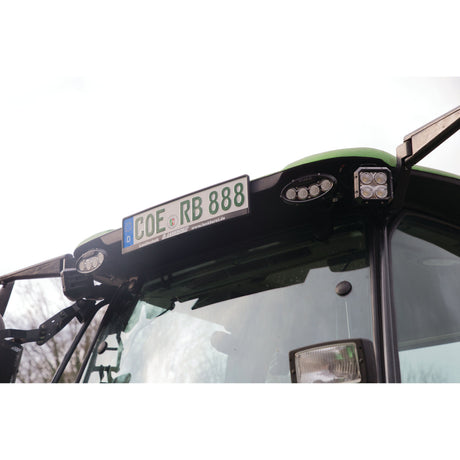 A close-up of a vehicle's license plate reading "COE RB 888" is mounted above its windshield and illuminated by Sparex LED Work Light (Cree High Power) on either side, providing clear visibility and easy access to information with 7000 lumens of raw power and an operating range between 10-60V.