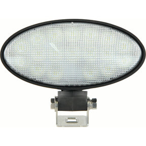 The John Deere LED Work Light by Sparex, featuring 4100 raw lumens and operating within a 10-30V range, is an oval-shaped worklight with a black bezel and a metallic mounting bracket at the bottom. It offers a flood beam for wide-area illumination and meets Class 3 interference standards.