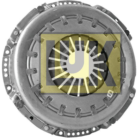 A metallic automotive part featuring a circular arrangement with a central opening, set against a logo with the letters "LUK" in yellow and black, showcasing its reliable design from the Clutch Cover Assembly - S.145261 by Sparex.