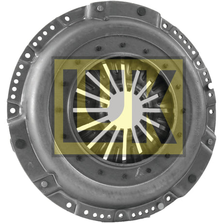 A close-up of a circular mechanical part with an industrial design, featuring a ring of holes around the edge and radial components in the center. The Clutch Cover Assembly - S.145312 from Sparex, crafted from pressed steel, showcases a yellow and black logo superimposed on the image.
