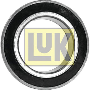 Close-up of a LUK Clutch Release Bearing - S.131116 by Sparex, featuring a metal bearing with a black ring and the letters "LUK" in a yellow box, providing critical manufacturing information.
