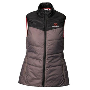 The AGCO Massey Ferguson Ladies Grey Padded Vest (X993322216) is a sleeveless, color-block quilted vest in black and grey with lightweight padding and a high zip-up collar. It features red lining visible on the armholes and a small red logo on the upper left chest. This women's padded jacket is made from 100% nylon fabric for added durability.