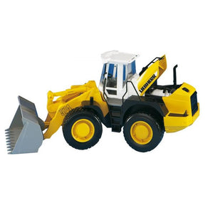 Image of the Bruder - Liebherr L574 Loader - T024307, a 1:16 scale yellow and black toy front loader with a white cab and a large bucket at the front, modeled after the Liebherr L574, from Gallaghers.