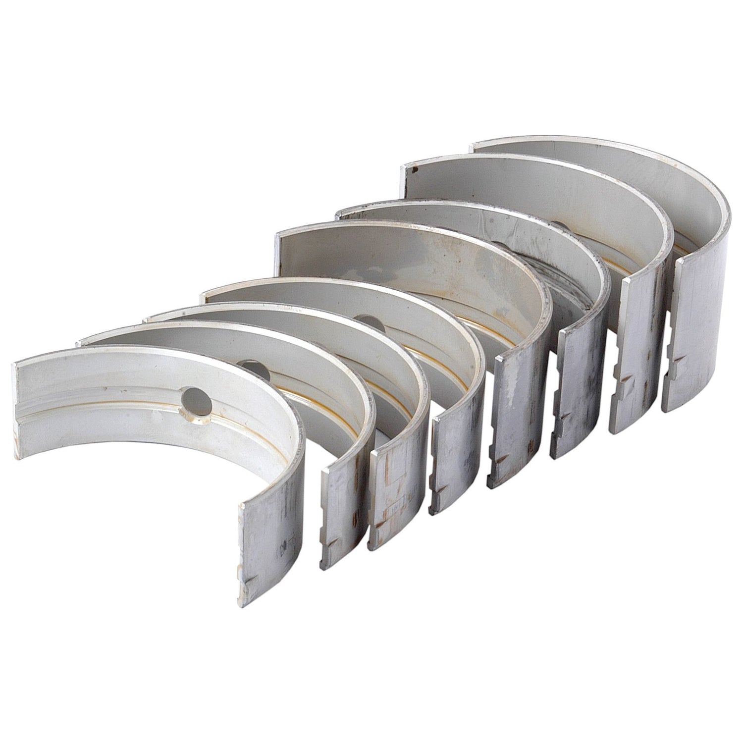 A set of six metallic engine bearings from Sparex, known as the Main Bearing +0.020'' (0.50mm) Set, arranged in a semi-circular formation.