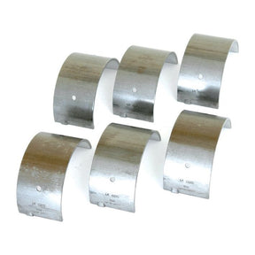 A close-up of six metallic Sparex Main Bearing +0.020'' (0.50mm) shells, arranged in two rows on a white background, ideal for Massey Ferguson and Landini machinery; available as set under Sparex Part No. S.42369.