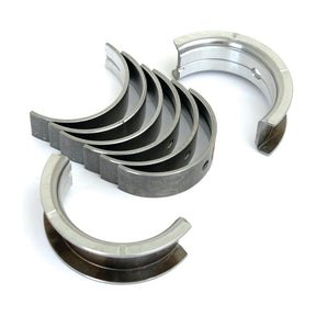 A set of six metal engine bearings, arranged in a semi-circular shape, branded by Sparex (Sparex Part No. S.57658), with one separated from the group and another partially visible.