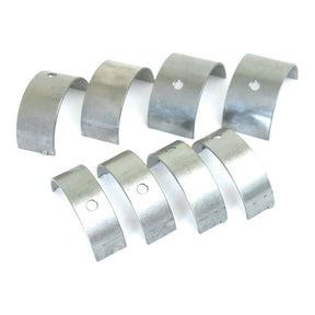 Sparex Main Bearing +0.030'' (0.75mm) Set, part number S.40334, comprises metal semicircular components arranged in two rows on a white background, each piece featuring a hole and indentations, commonly used in Perkins and Massey Ferguson machinery.