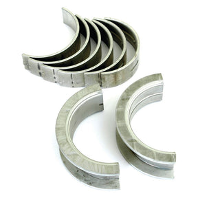 A set of seven metallic Sparex Main Bearing +0.030" (0.75mm) (Set), identified as Sparex Part No. S.65221, arranged in a semi-circular formation against a white background.
