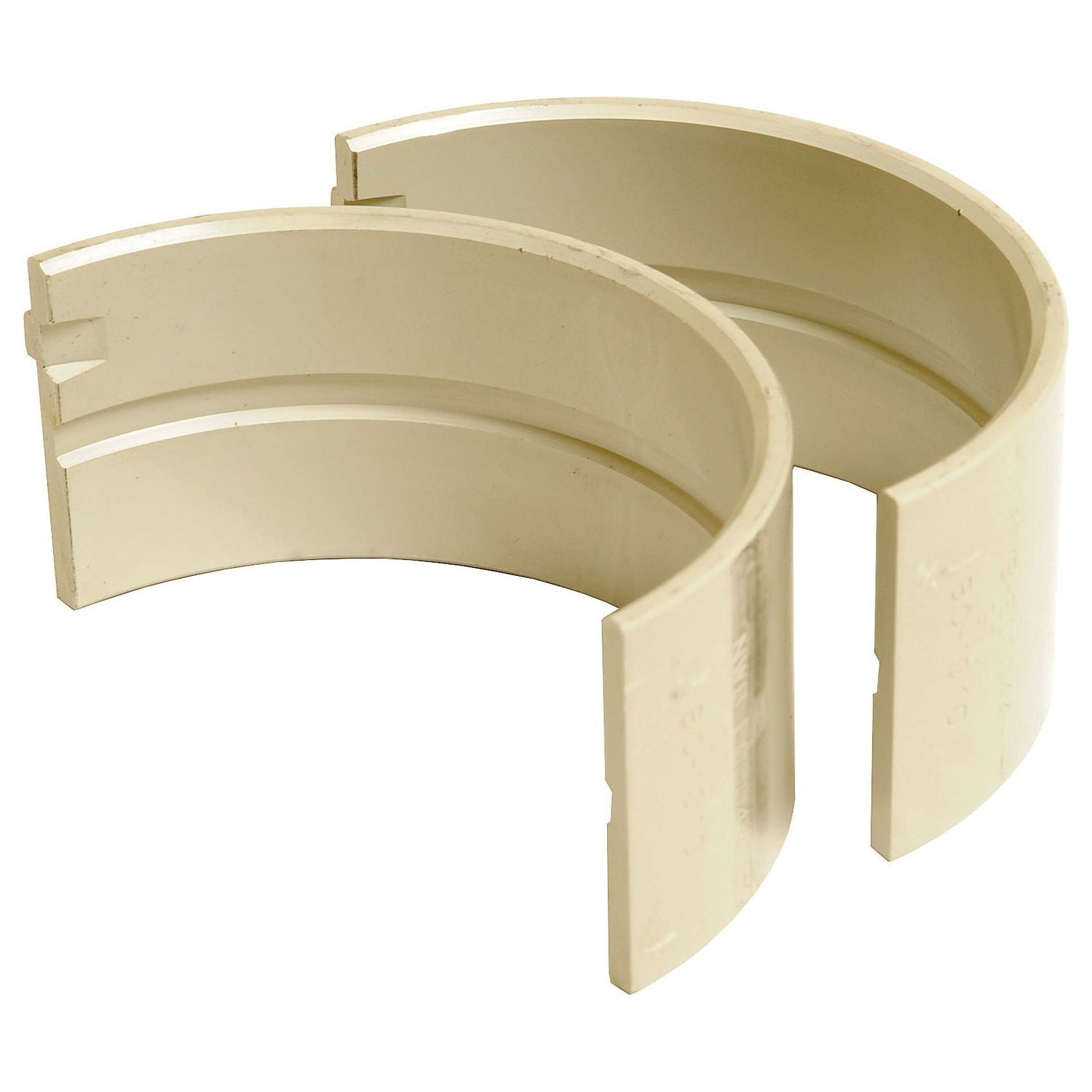 Two semicircular beige plastic pipe connectors with notches on one end, compatible with Valmet Valtra machinery, from the Main Bearing Std. (Pair) by Sparex (Sparex Part No. S.67320).