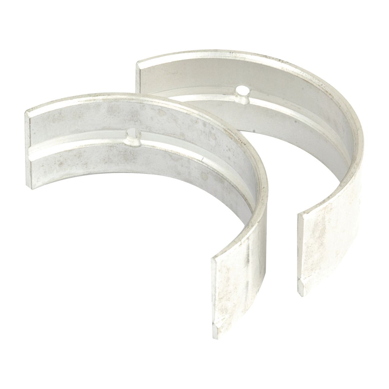 Two metal connecting rod bearings positioned side by side, displaying their curved structure and open ends, perfect for Kubota tractors. Find the reliable Main Bearing Std. (Set) at Sparex, Part No.S.22500.