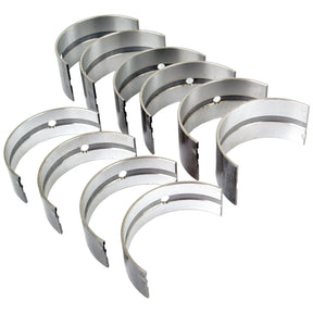 A set of eight silver Main Bearing Std. (Set) by Sparex (Part No.S.52619) arranged in two curved rows, suitable for Leyland machinery, isolated on a white background.