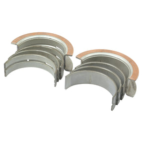 Two sets of Main Bearing Std. (Set) | Sparex Part No.S.65218, featuring visible copper layers in a semi-circle configuration on a white background. Ideal for various models, including Ford New Holland and Case IH International Harvester, from the reputable brand Sparex.