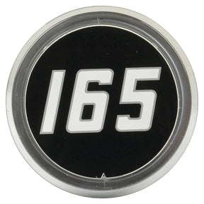 Round black badge featuring the number "165" in bold white numerals on the front, encircled by a silver metallic rim, reminiscent of the classic Massey Ferguson 165 medallion. This is Sparex's Medallion - Massey Ferguson 165 (Sparex Part No.S.42548).