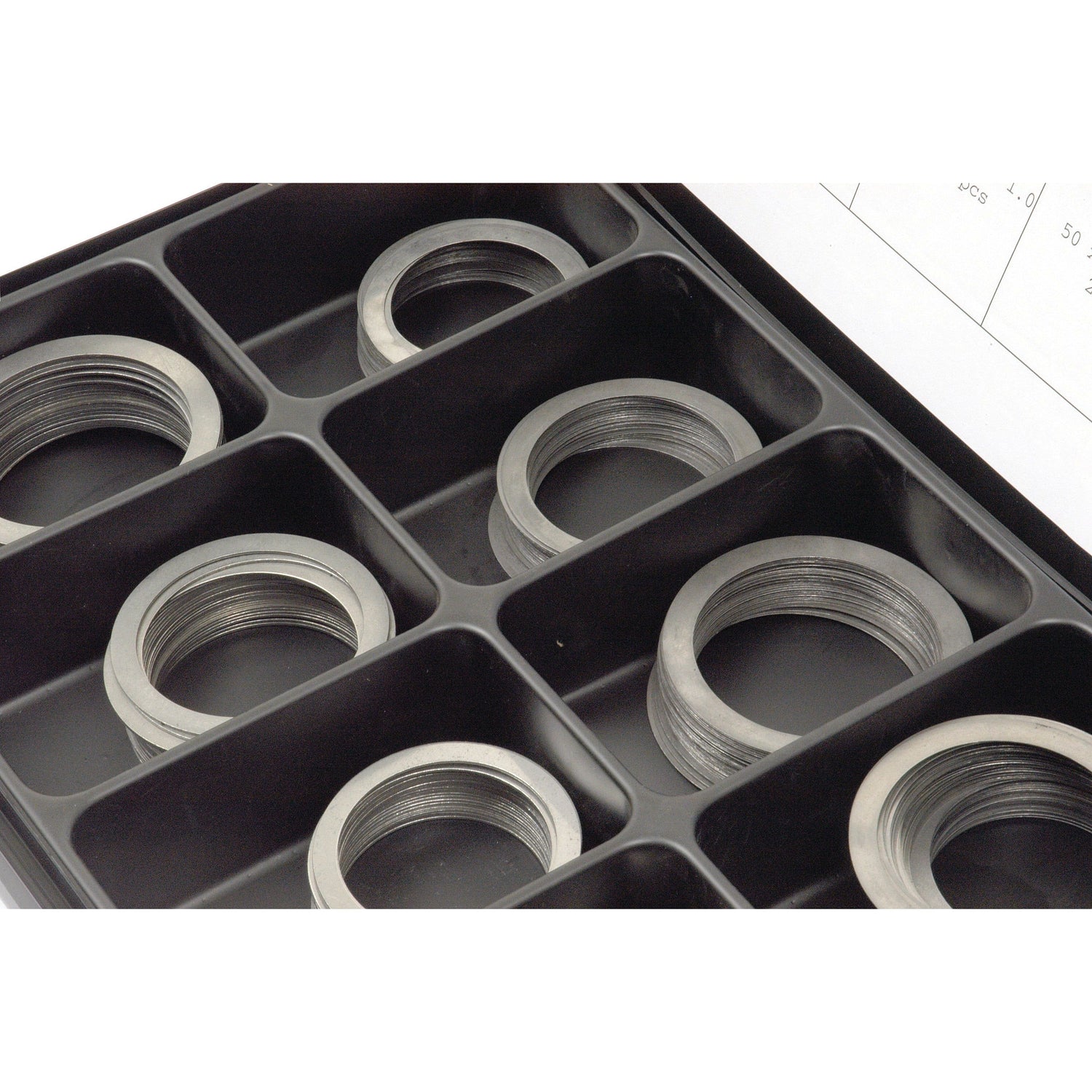 A Sparex Handipak storage box containing multiple Metric Shim Washers (DIN 988) with inner diameters ranging from 50-60mm and outer diameters ranging from 62-75mm, organized in individual compartments, Part No. S.21139.