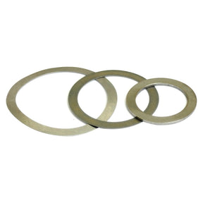 Three metallic washers of different sizes, including a Sparex Metric Shim Washer with a 50mm ID, are laid next to each other against a white background.
