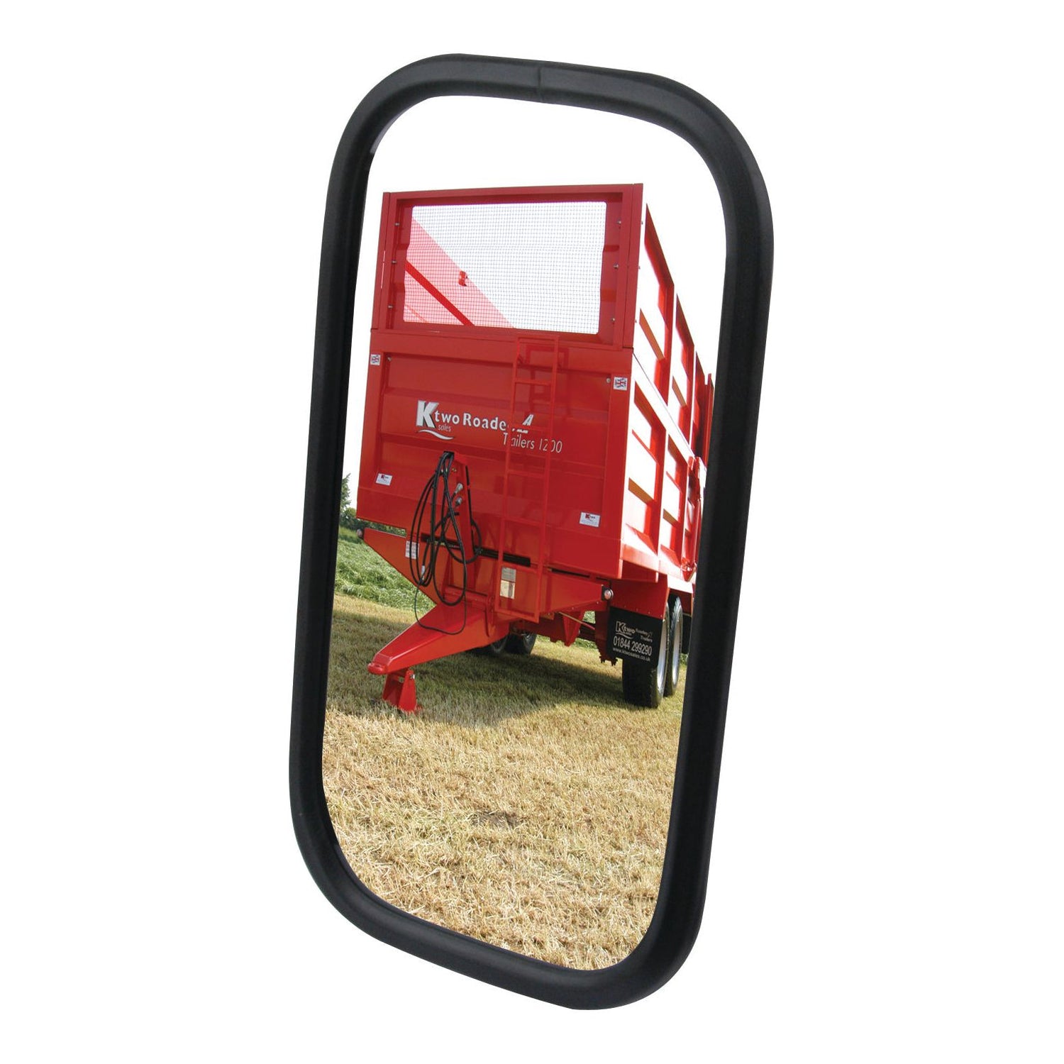 A red trailer with "K Two Roade Team 1330" printed on it, reflected in a Sparex Mirror Head - Rectangular, Flat, 240 x 130mm (RH & LH) - S.6220 with a black frame, parked on a grassy area.