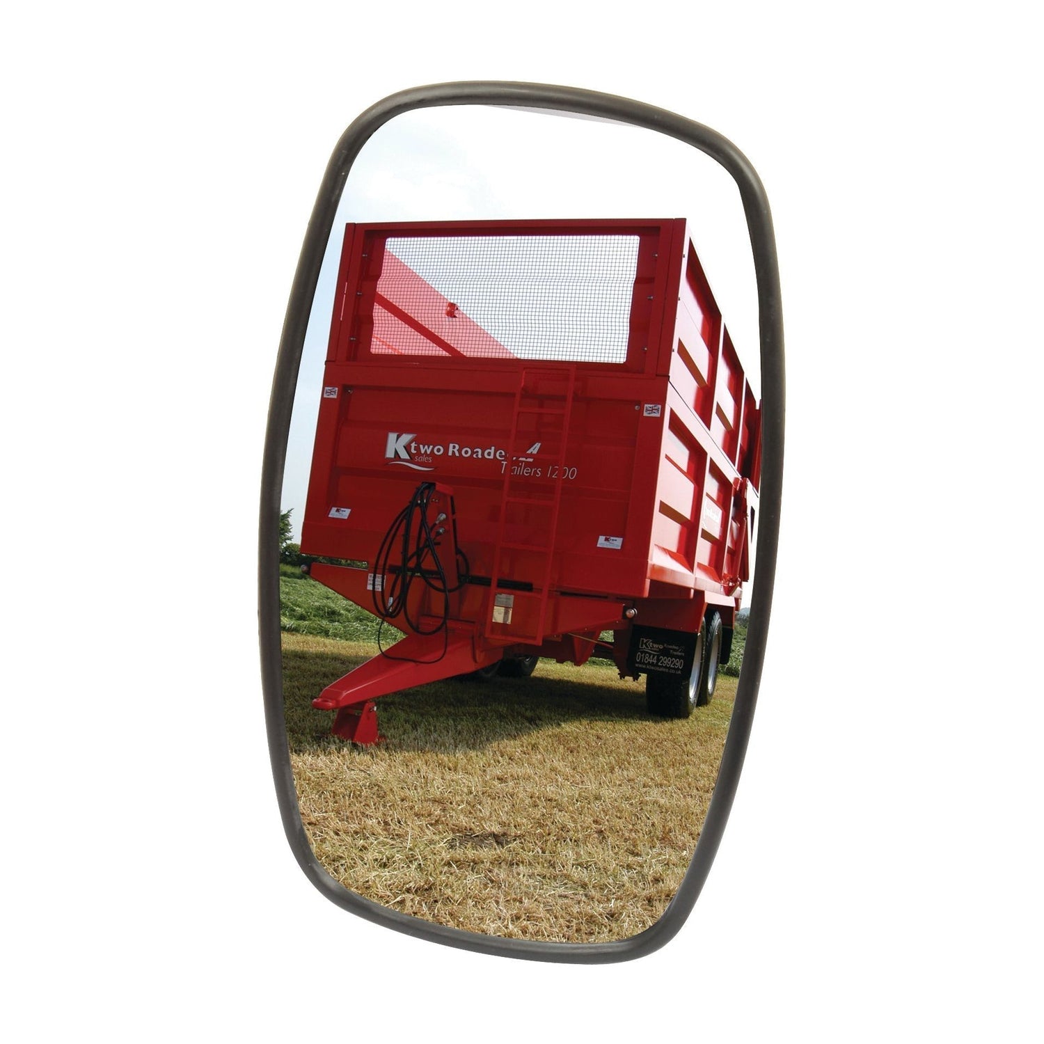 A red agricultural trailer with a mesh top is reflected in a 250 x 140mm rectangular Sparex Mirror Head (S.39700) against a grassy field backdrop, epitomizing the reliability of Sparex and the strength of Fendt.