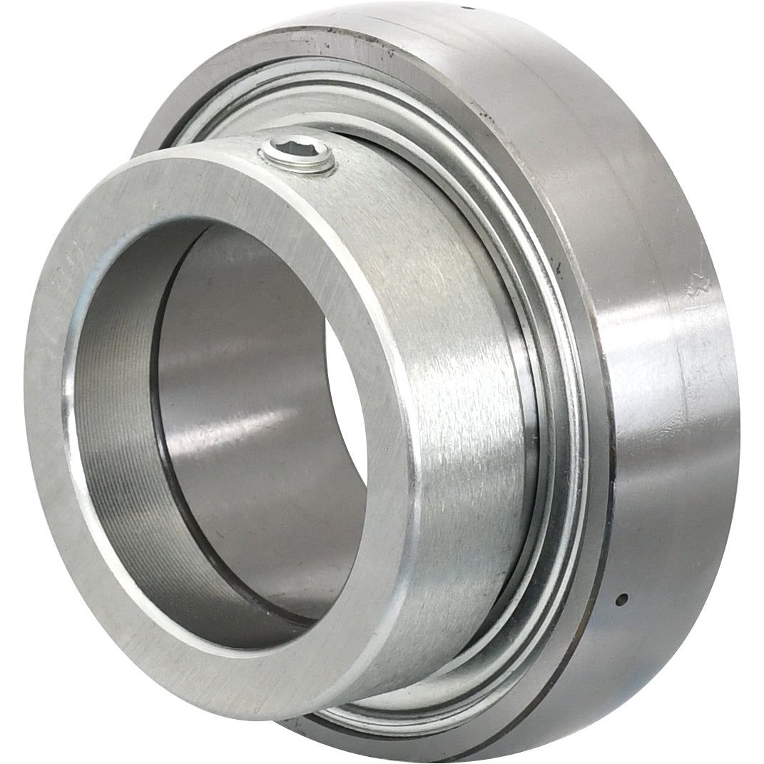 The NTN SNR Plummer Block Bearing Insert (ES211) - S.138385 by Sparex is a metallic mechanical bearing with multiple concentric cylindrical components, featuring a smooth, polished surface and a bolt visible on the outer ring. Suitable for various applications, it adds elegance and efficiency to any machine setup.