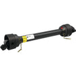 A Sparex PTO Shaft (S.143666) measuring 1010mm in length, with a 1 3/8'' x 6 Spline Q.R. to 1 3/4'' x 6 Spline configuration, features an 80HP Shear Bolt Limiter, black protective coverings on both ends, metal clips, and a label in the center.