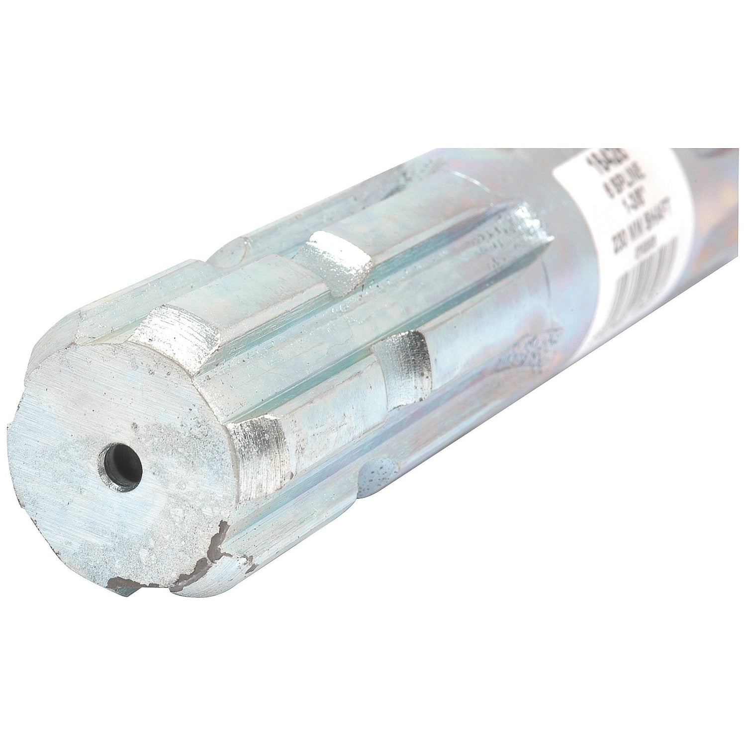 Close-up view of the Sparex PTO Splined Shaft - Both Ends - 1 3/8'' - 6 Spline x 1 3/8'' - 6 Spline, Length: 150mm (Part No. S.16615) with a threaded hole at one end. This cylindrical rod has a shiny, metallic surface and multiple ridges along its body. A barcode label is partially visible.