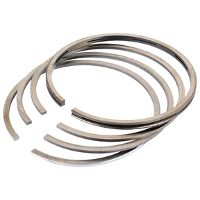 A set of five metallic piston rings, each sized at +0.020" (0.50mm) and arranged slightly overlapping each other on a white background, featuring the Sparex Part No.S.4957509 branding.