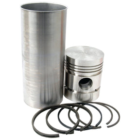 A metal engine cylinder, piston, and several piston rings are arranged neatly as part of the high-quality Piston Ring and Liner Kit for Massey Ferguson tractors by Sparex (Part No. S.40444).