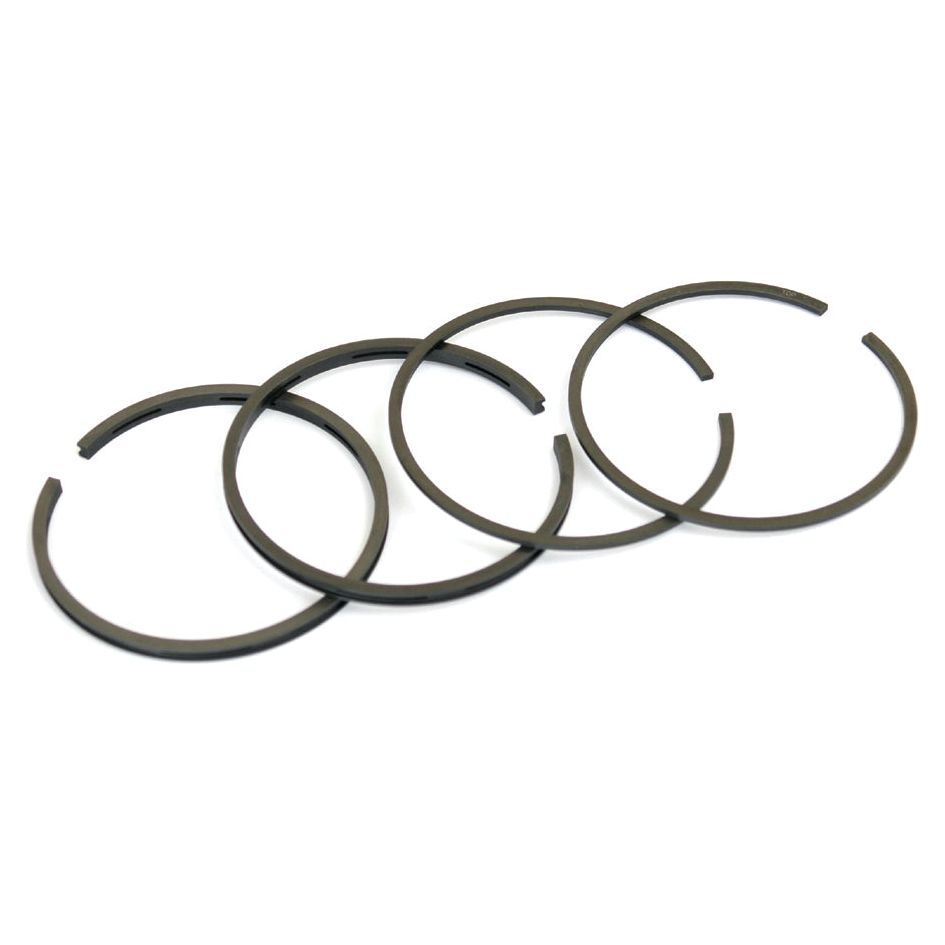 Four black metal piston rings, identified as the Sparex Piston Ring with Part No. S.41615 for Massey Ferguson engines, are arranged in a row on a white background.