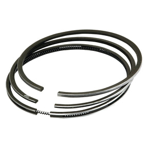 Close-up image of three Sparex Piston Rings (Part No. S.57633) arranged in a slightly overlapping manner, showcasing their chrome-plated, coiled, and split-ring design.