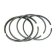 A set of four Sparex Piston Rings, Part No. S.62335, arranged in an overlapping pattern, shine brightly on a white background.
