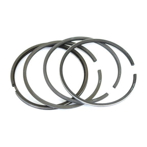 A set of four Sparex Piston Rings, Part No. S.62335, arranged in an overlapping pattern, shine brightly on a white background.