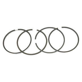 Four Sparex S.65996 piston rings are lined up in a row against a white background, showcasing their precision craftsmanship. With a bore of 4.2", these rings are Ford/New Holland compatible, ensuring optimal performance and reliability.
