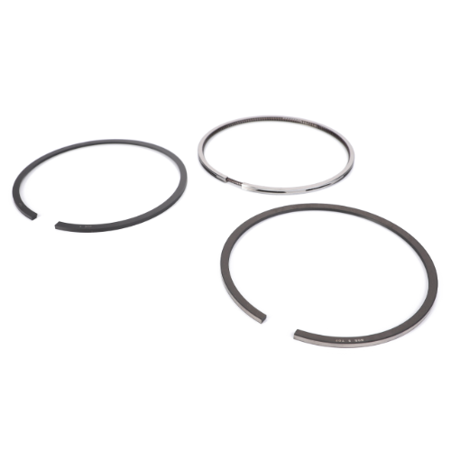 Displayed on a white background are three metallic piston rings: one silver and two black, each with an open end. These crucial tractor parts are part of the Massey Ferguson Piston Ring Set (V836640078) by AGCO.