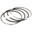 A set of four metallic piston rings, partially overlapping and arranged in a circular pattern, chrome-plated and suitable for automotive engine use, known as the Piston Ring Std. | Sparex Part No.S.58894 by the brand Sparex.