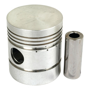 A Sparex Piston (Standard) - S.57628, featuring a flat top and accompanied by a cylindrical pin, is displayed against a white background. The piston showcases grooves, a large central hole, and precise bore diameter specifications.