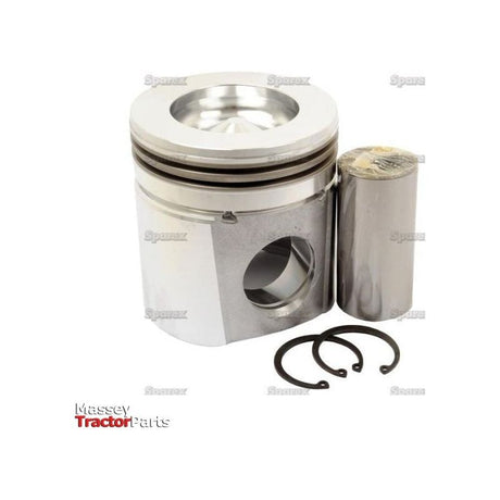 A metal piston, equipped with two piston rings, a piston pin, and circlips, is showcased on a white background. The phrase "Massey Tractor Parts" can be partially seen at the bottom left corner, emphasizing the precision bore diameter of this vital Sparex component known as Piston (Standard) - S.67975.