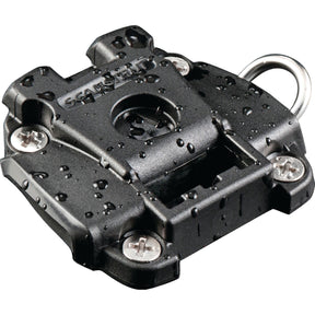 A close-up of a wet, black ROKK™ Mini Surface Mount - S.119754 by Sparex with visible screws and a metal loop. The mount is labeled "Scanstrut." Water droplets are scattered over its surface.