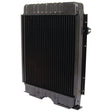 Image of a black automotive radiator, specifically the Radiator - S.67948 from Sparex, standing upright with vertical cooling fins and a sturdy rectangular frame.