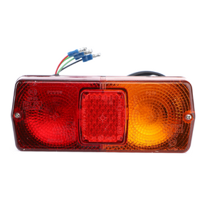 The AGCO Massey Ferguson Rear Light (L/H or R/H) - 3476047M91 is a rectangular vehicle tail light with three segments, featuring red and amber lenses. It is ideal for 300 Series Massey Ferguson tractor models and includes wires with connectors extending from the rear.