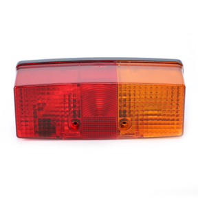 The Fendt Rear Light R/H (X830180046000) by AGCO is a rectangular vehicle tail light with red, amber, and clear sections for brake, indicator, and reverse lights that ensures optimal illumination. Crafted with durable quality in mind, it features AGCO Genuine Lighting Parts for reliable performance.