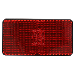 The AGCO Massey Ferguson reflector (part number 3618951M1) is a rectangular red reflector with a textured surface and black border, ideal for Massey Ferguson 3000 Series tractor parts.