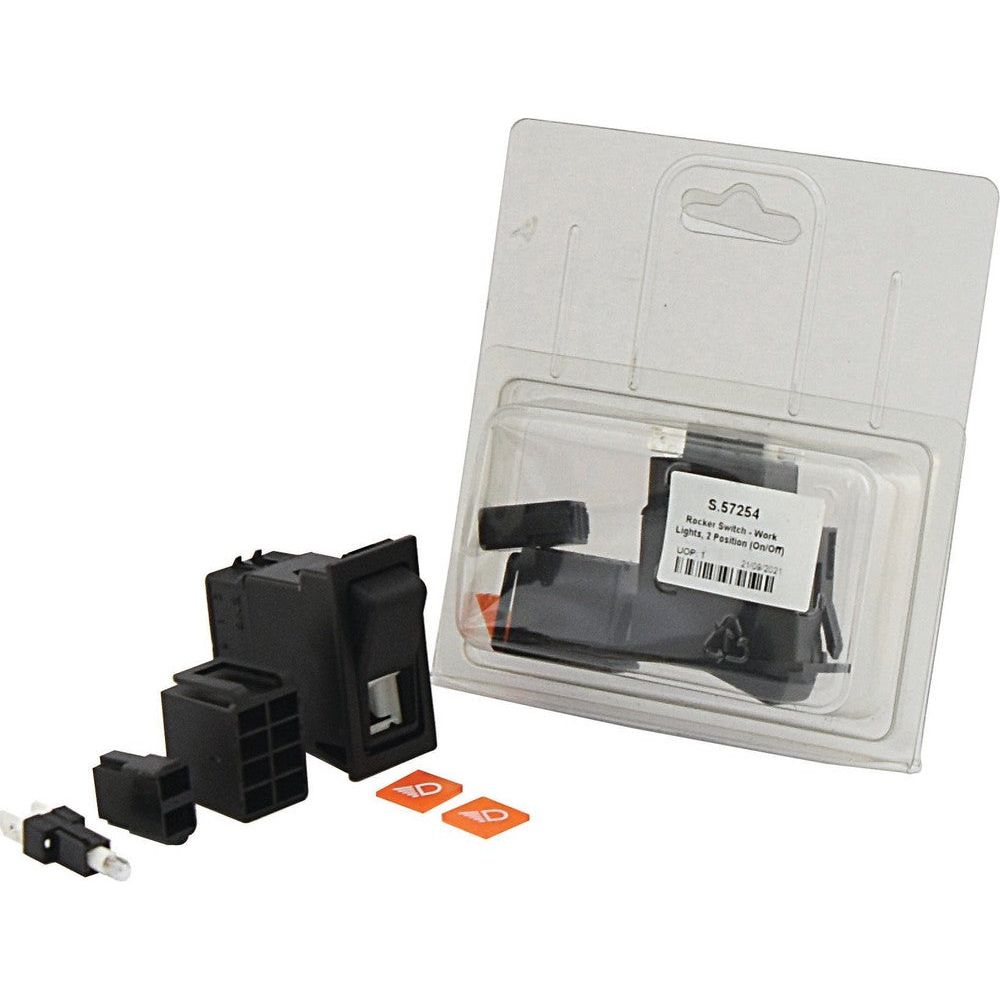 Plastic packaging containing a black plastic modular component with additional smaller parts and labels, labeled "S.57254". This package includes an IP65 rocker switch designed for 12V DC, ideal for Agripak work lights, branded by Sparex.