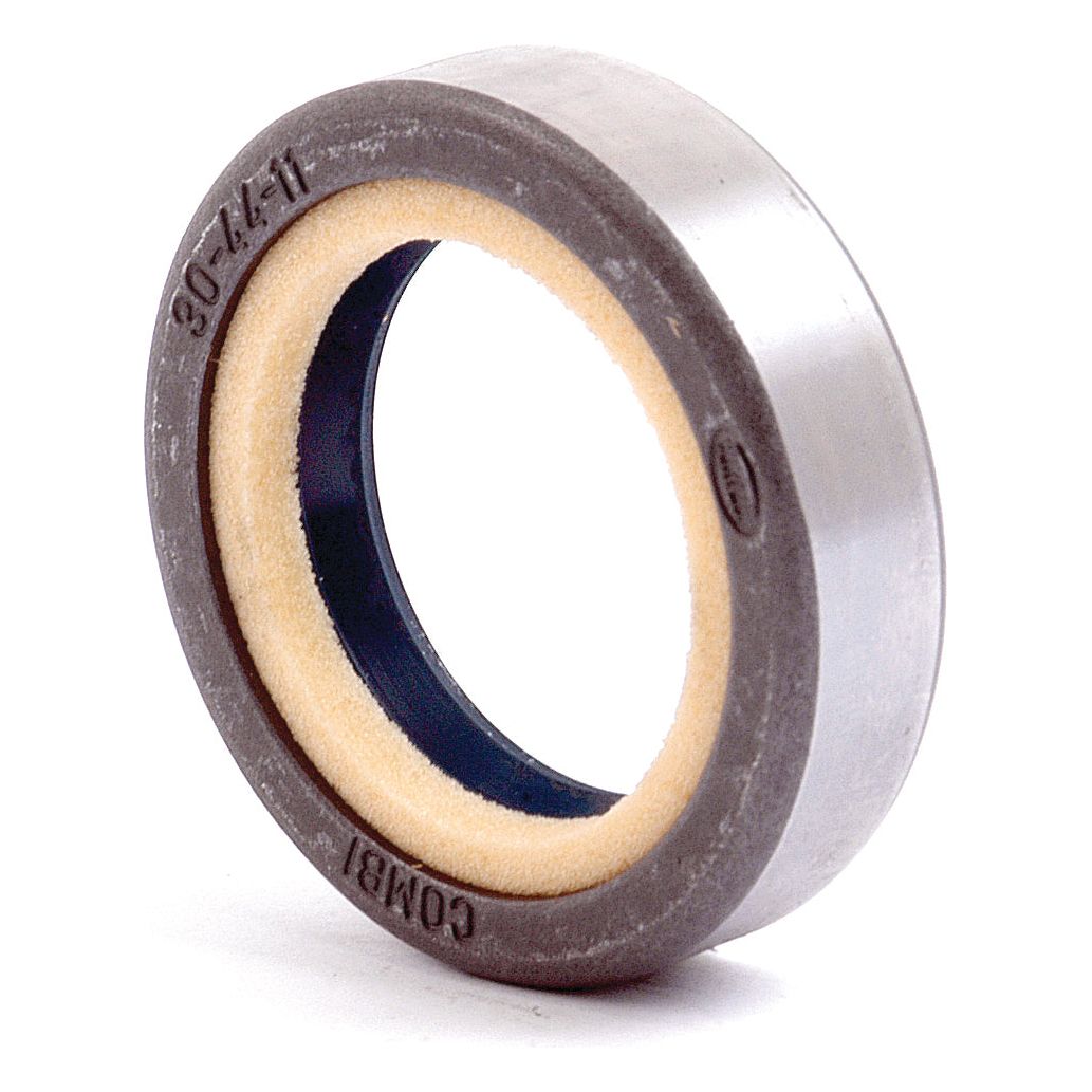 A close-up of an industrial metal oil seal, commonly used in Case IH and John Deere machinery, with a visible part number "S.59587". The Sparex oil seal features an outer metallic ring and an inner rubber section.