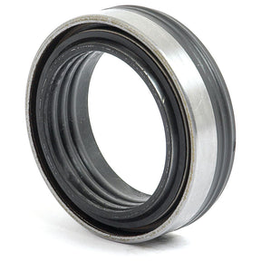 Close-up of a metal and rubber mechanical seal with concentric ridges and a shiny outer surface, ideal for use in Landini machinery. This is the Seal - Flange Housing 43.5 x 63.5 x 17.5/19mm by Sparex (Sparex Part No.S.43340).